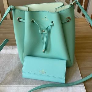 Kate Spade bucket purse, matching Kate spade wallet and phone case
